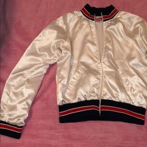 White jacket with red white and blue stripes